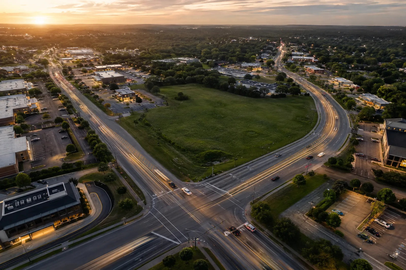 Aerial view of a suburban commercial intersection illustrating traffic and access analysis